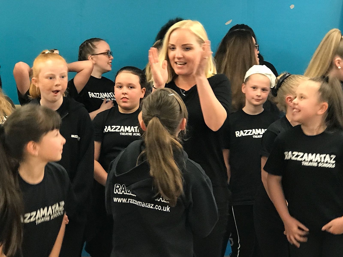 Theatre school students sing with West End star part time franchise uk