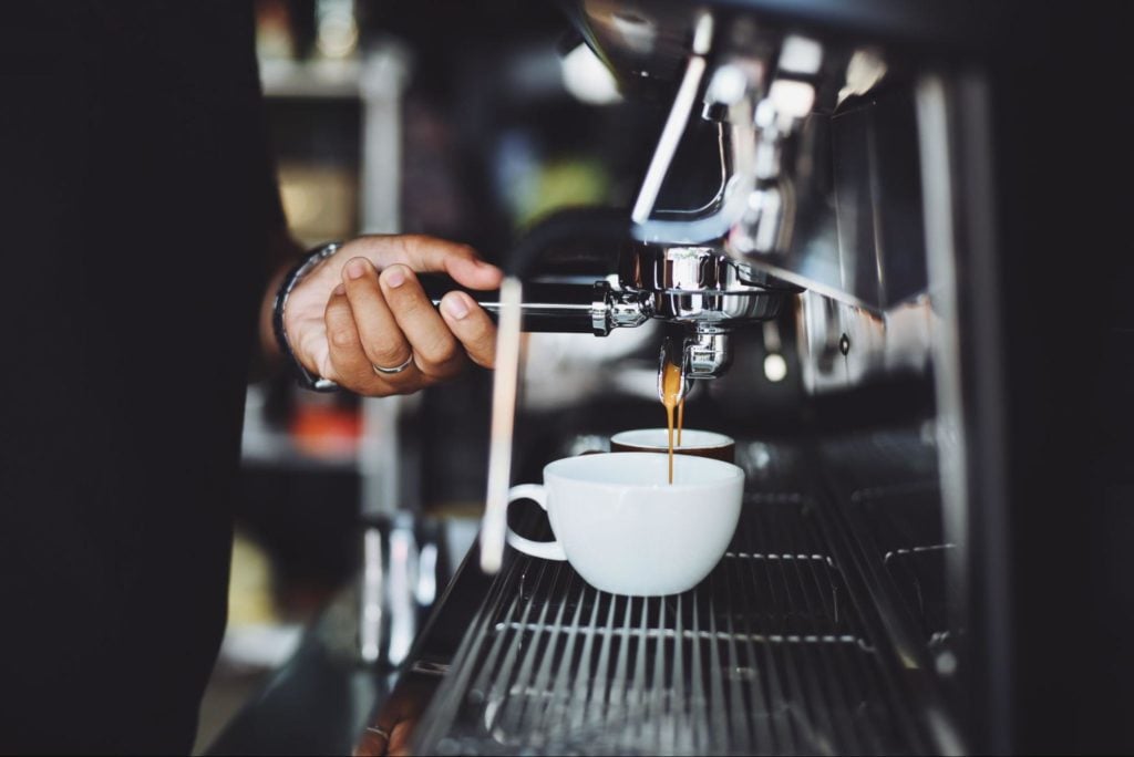 Preparing capuccino at Starbucks franchise