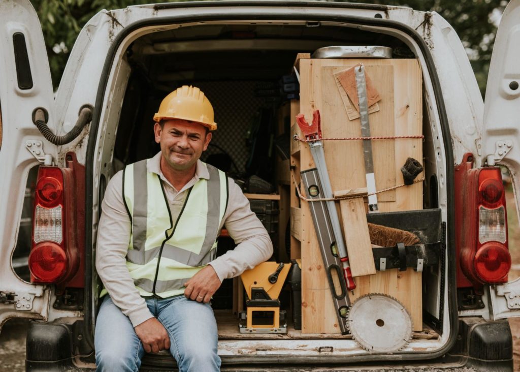 Man sitting in his van-based franchise