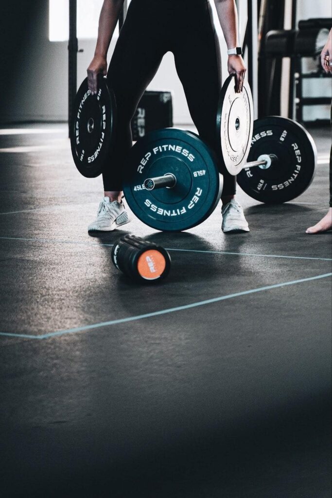 barbell and a foam roller barbell and a foam roller