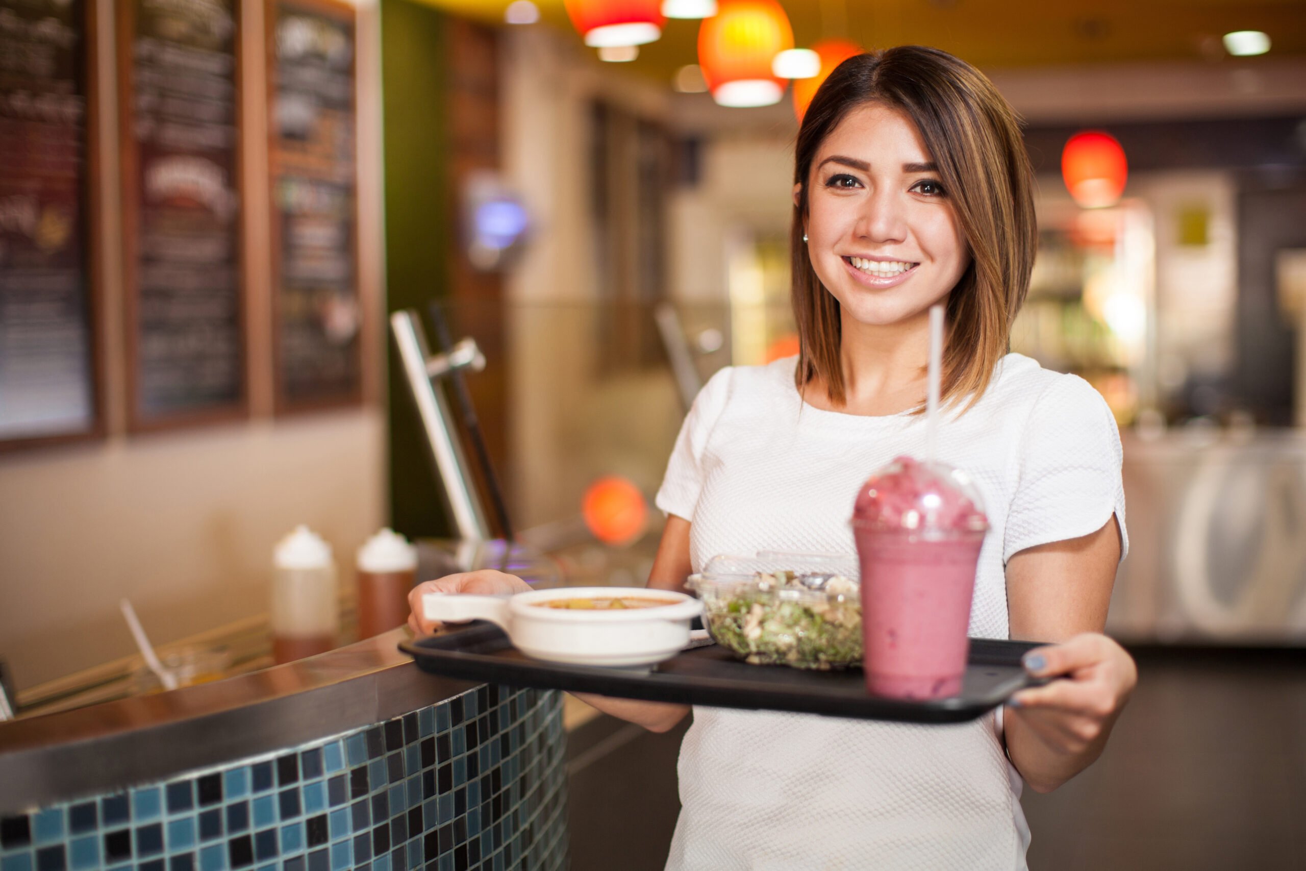 Cute girl eating at a cafeteria