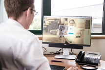Man at computer, researching InXpress franchise